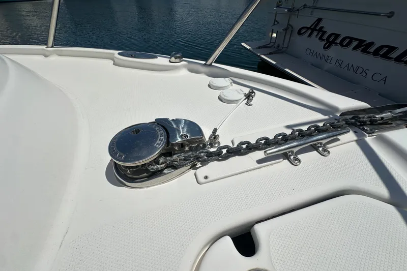 Slide: The Image of 2006 Robalo R245 Walkaround boat deck with anchor chain and winch system. - 21