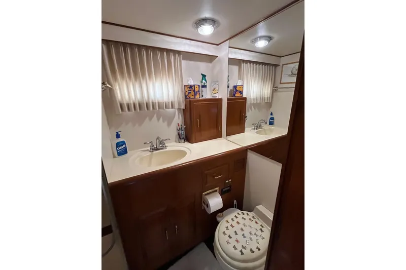Slide: The Image of Bathroom interior of 1989 Ocean Alexander 440 Sundeck CPMY yacht, featuring sink and toilet. - 17