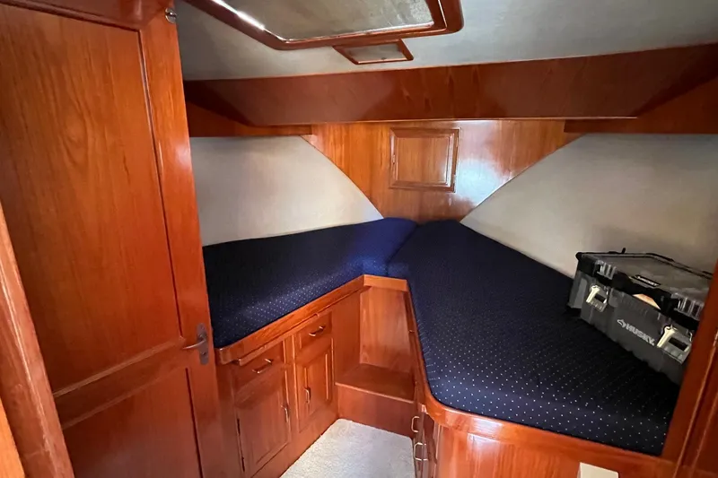 Slide: The Image of 1989 Ocean Alexander 440 Sundeck CPMY cabin with wooden interior and twin beds. - 19