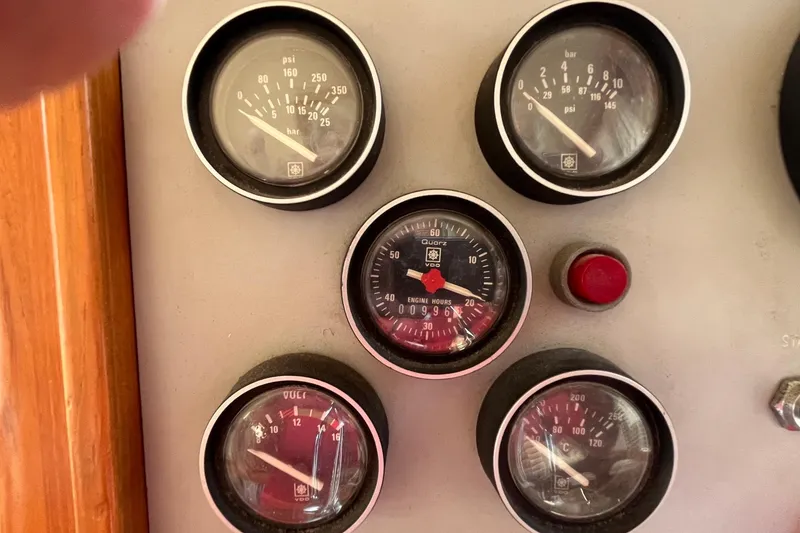 Slide: The Image of Instrument panel of 1989 Ocean Alexander 440 Sundeck CPMY with gauges and red button. - 2