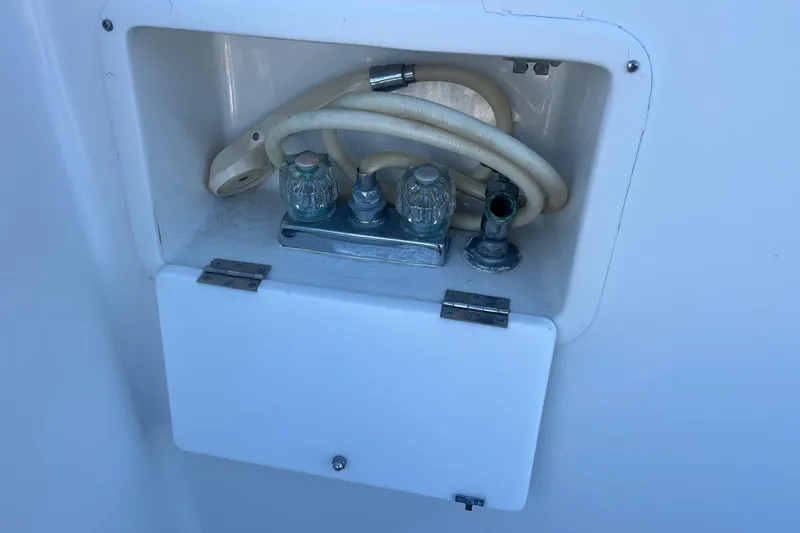 Slide: The Image of Water hose compartment on a 1989 Ocean Alexander 440 Sundeck CPMY yacht. - 28