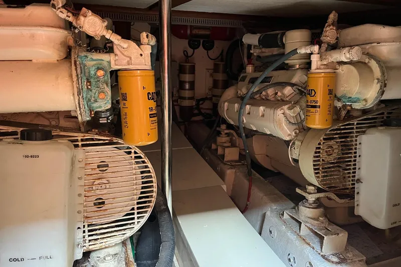 Slide: The Image of Engine room of 1989 Ocean Alexander 440 Sundeck CPMY with visible machinery and filters. - 29