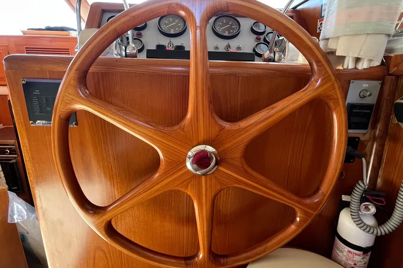 Slide: The Image of Wooden steering wheel of 1989 Ocean Alexander 440 Sundeck CPMY yacht cockpit. - 7