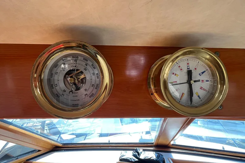 Slide: The Image of Brass nautical instruments on 1989 Ocean Alexander 440 Sundeck CPMY yacht interior. - 8