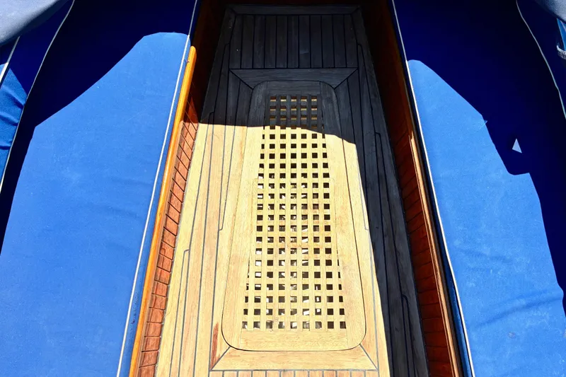 Slide: The Image of Interior view of a 2003 Castine Harbor Launch boat with wooden flooring. - 17