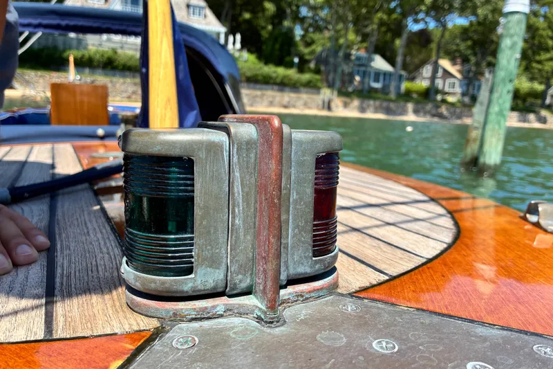 Slide: The Image of Navigation lights on a 2003 Castine Harbor Launch boat deck, with scenic waterfront background. - 21