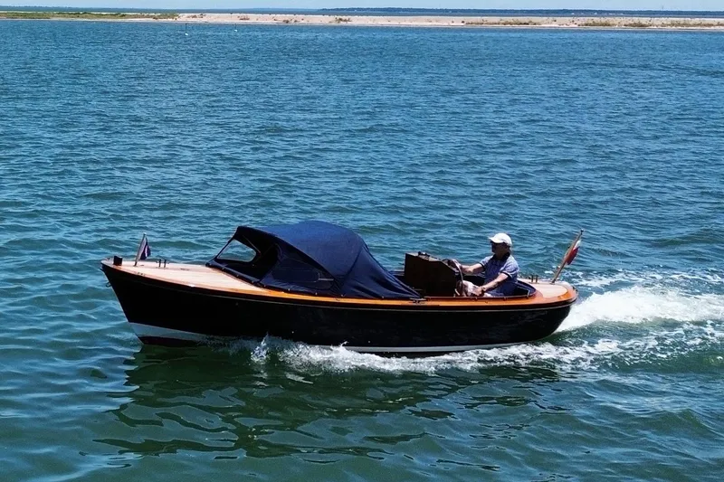 Slide: The Image of 2003 Castine Harbor Launch boat cruising on open water. - 6