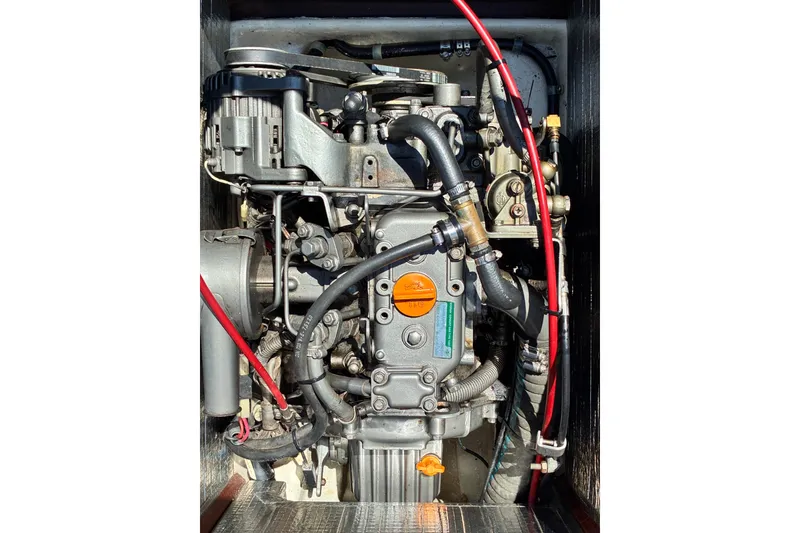 Slide: The Image of Engine of a 2003 Castine Harbor Launch, showcasing intricate mechanical components and wiring. - 22