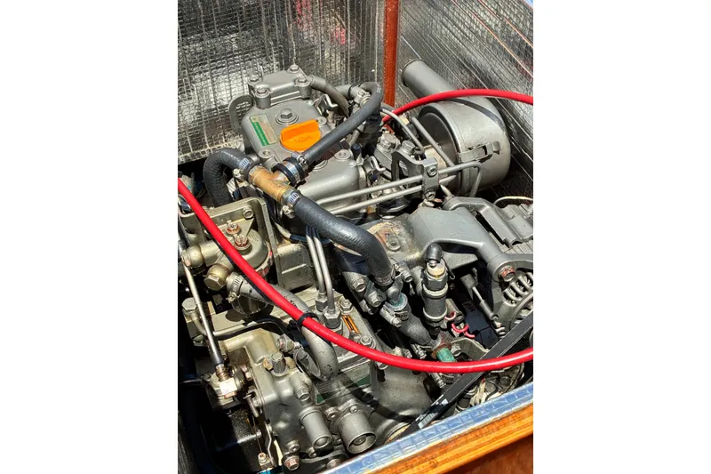 Slide: The Image of Engine of a 2003 Castine Harbor Launch boat, featuring detailed mechanical components. - 20