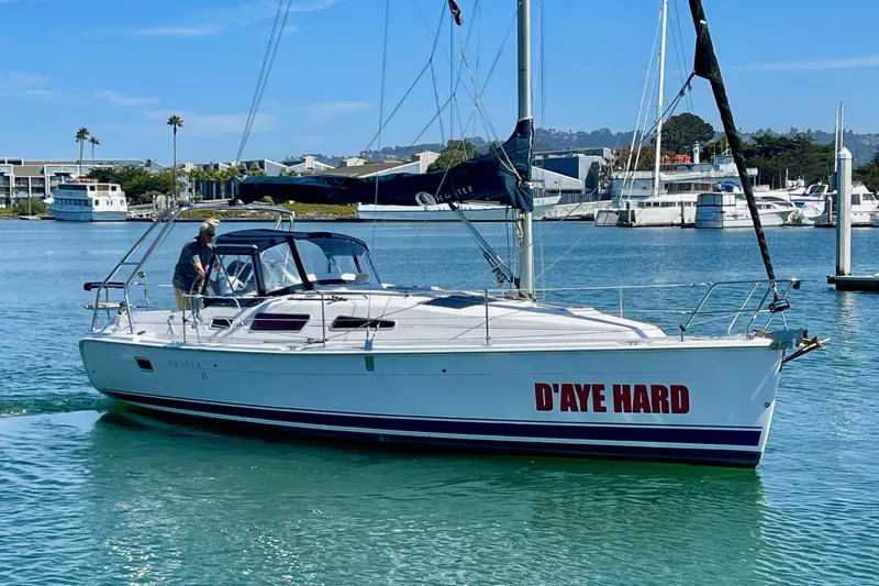 Slide: The Image of Sailboat "D'AYE HARD," Hunter 33-2, 2004 model, cruising in a marina. - 1