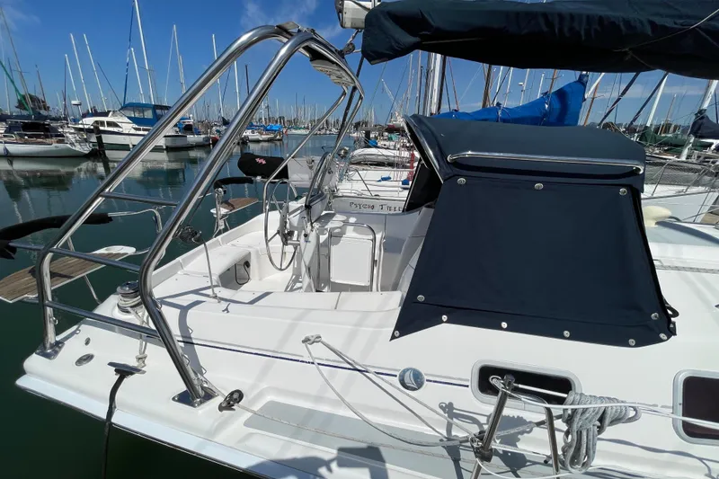 Slide: The Image of Sailboat Hunter 33-2, 2004 model, docked in marina with stainless steel railings. - 8
