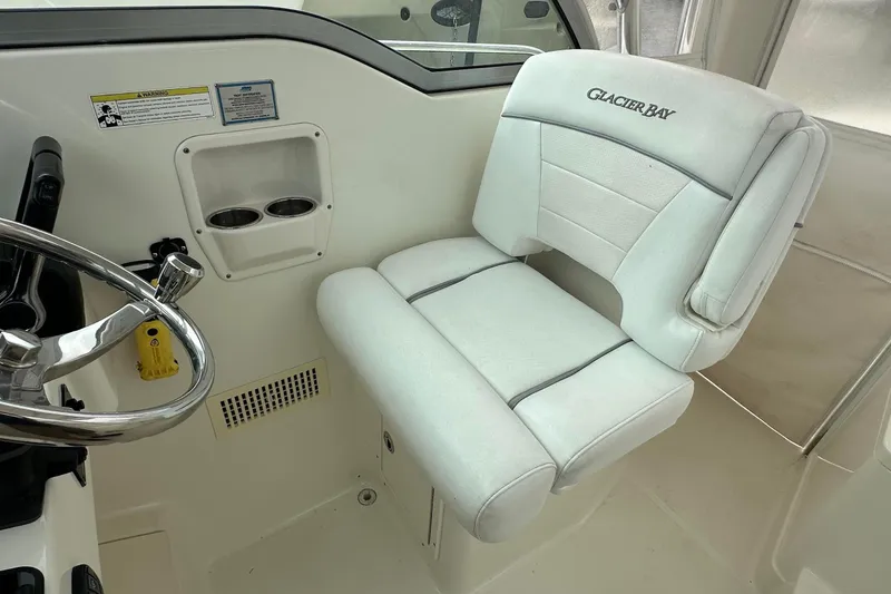 Slide: The Image of Captain's seat in 2013 Glacier Bay 2680 Coastal Runner boat cockpit. - 10