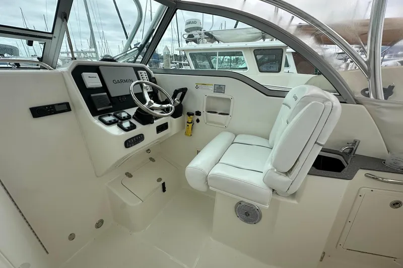Slide: The Image of 2013 Glacier Bay 2680 Coastal Runner boat cockpit with Garmin navigation system. - 11
