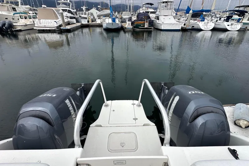 Slide: The Image of 2013 Glacier Bay 2680 Coastal Runner with twin Yamaha engines docked at marina. - 2
