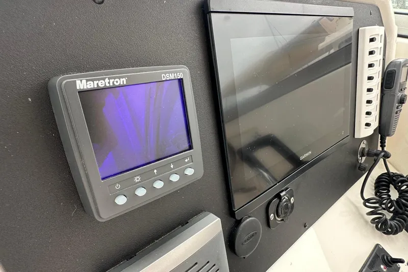 Slide: The Image of Control panel of a 2013 Glacier Bay 2680 Coastal Runner with Maretron and Garmin displays. - 8