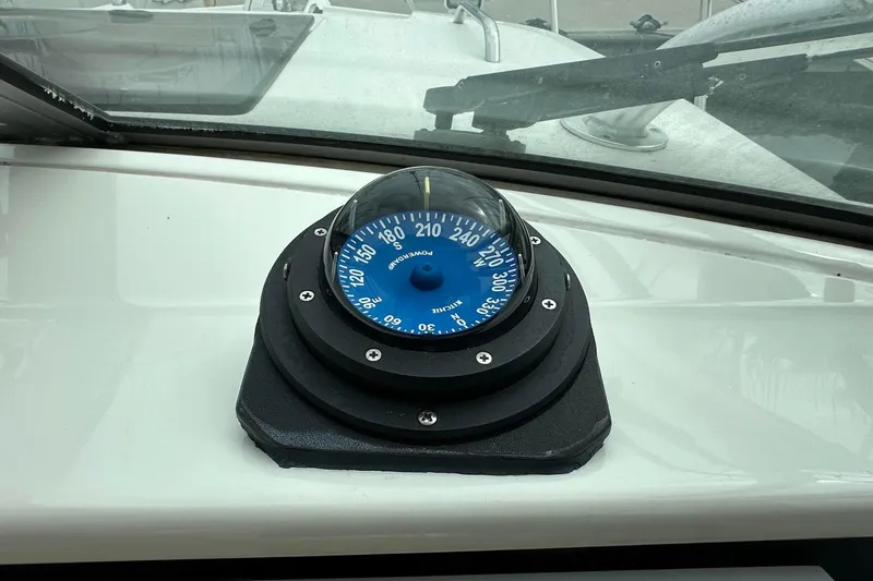 Slide: The Image of Compass on 2013 Glacier Bay 2680 Coastal Runner boat dashboard. - 9