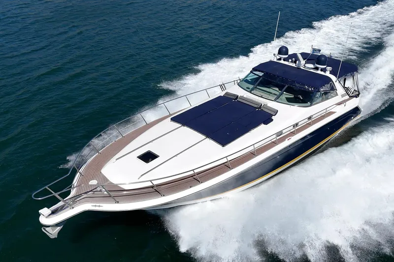The Image of 1999 Sea Ray 500 Sundancer yacht cruising on open water, showcasing sleek design and luxury. - 0