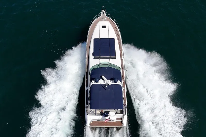 Slide: The Image of Aerial view of 1999 Sea Ray 500 Sundancer yacht cruising on open water. - 2