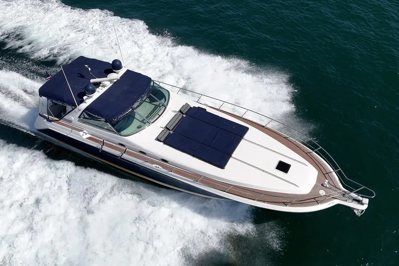 Slide: The Image of 1999 Sea Ray 500 Sundancer yacht cruising on open water, aerial view. - 5