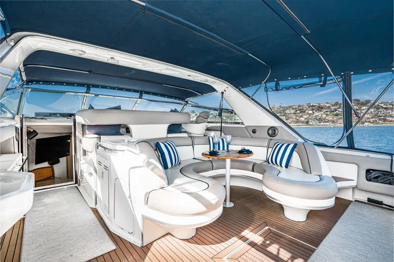 Slide: The Image of Luxurious 1999 Sea Ray 500 Sundancer yacht interior with elegant seating and scenic ocean view. - 8