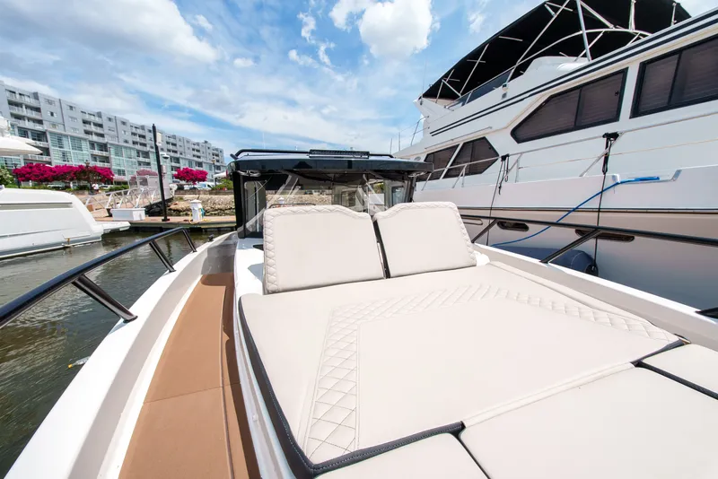 Slide: The Image of A modern boat with comfortable lounging areas docked at the marina. - 14