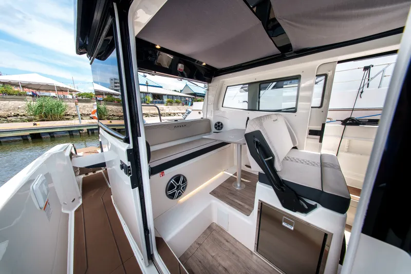 Slide: The Image of Interior view of a modern boat with seating area and table. - 15