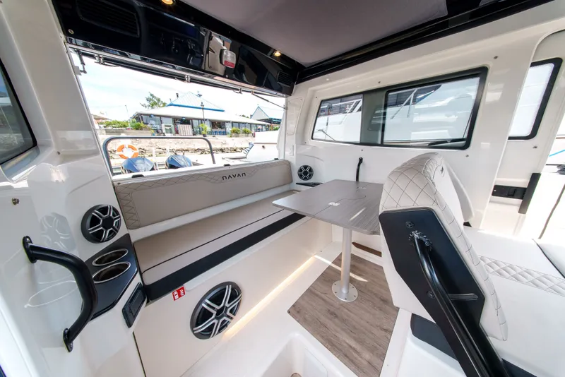 Slide: The Image of Interior of a modern boat with seating area and table. - 16