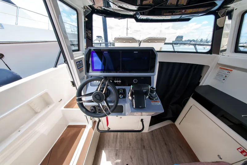Slide: The Image of Interior view of a modern boat helm with steering wheel and instruments. - 17