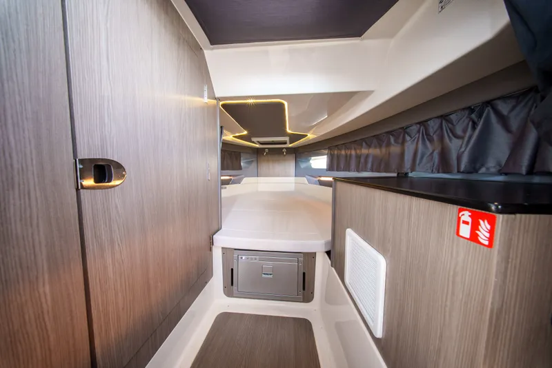 Slide: The Image of Interior of a modern yacht with wood paneling and a cozy bed. - 23
