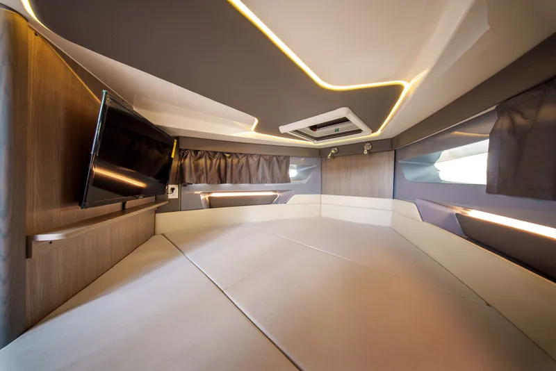 Slide: The Image of Modern boat interior with cozy seating area, TV, and stylish lighting. - 24