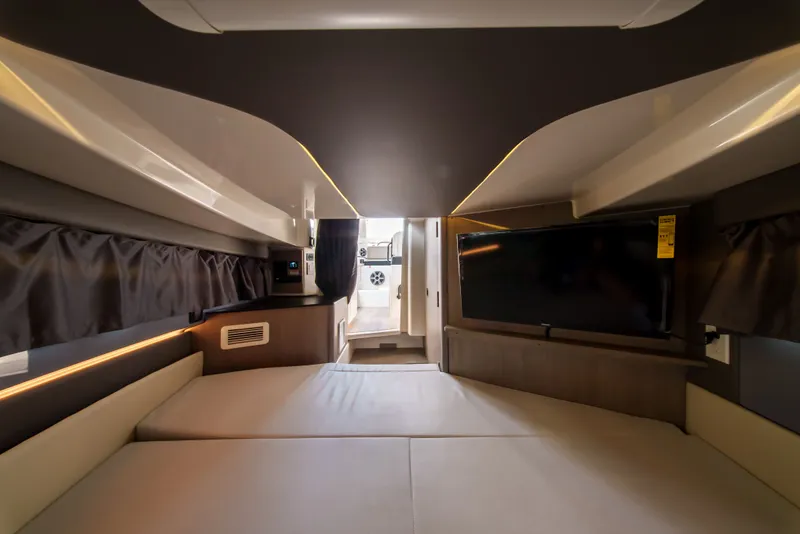 Slide: The Image of Interior of a modern yacht with a cozy bed and flat-screen TV. - 25