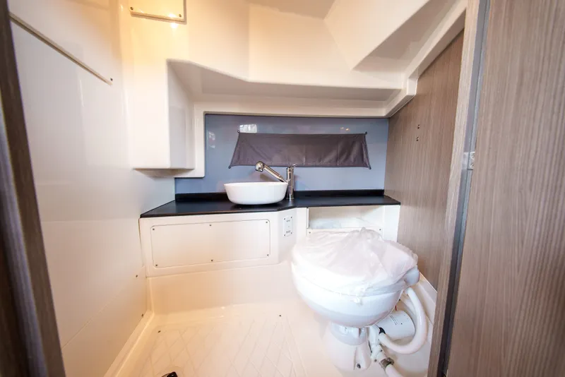 Slide: The Image of Modern bathroom on a boat with a sink and toilet. - 26