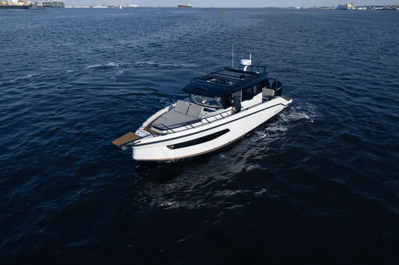 Slide: The Image of A modern boat with an open deck cruising on calm waters. - 4