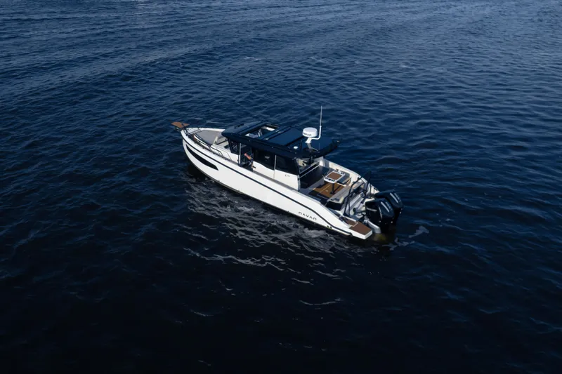 Slide: The Image of A modern motorboat cruises on calm water. - 5