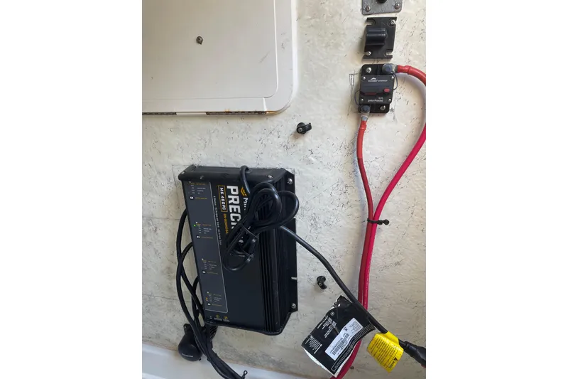 Slide: The Image of 2006 Sailfish 2660 CC boat electrical system with charger and wiring setup. - 15