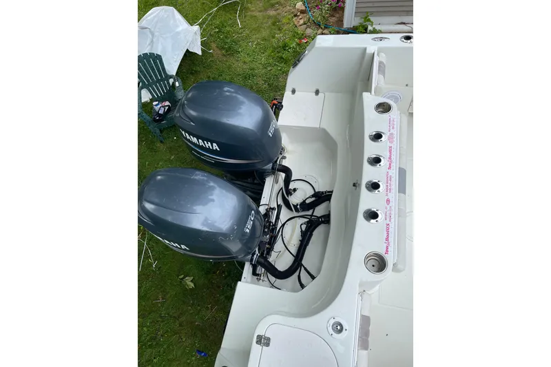 Slide: The Image of 2006 Sailfish 2660 CC boat with dual Yamaha outboard motors, viewed from above. - 5