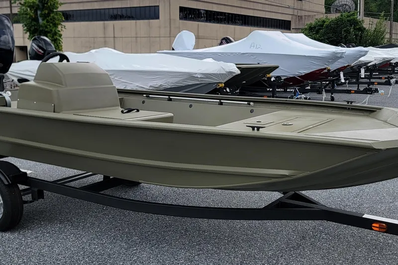 The Image of 2026 Tracker Grizzly 1648 SC boat on trailer, parked outdoors. - 0
