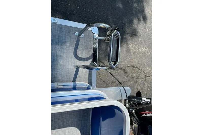 Slide: The Image of 2026 Sun Tracker Party Barge 18 DLX boat ladder and motor detail. - 14