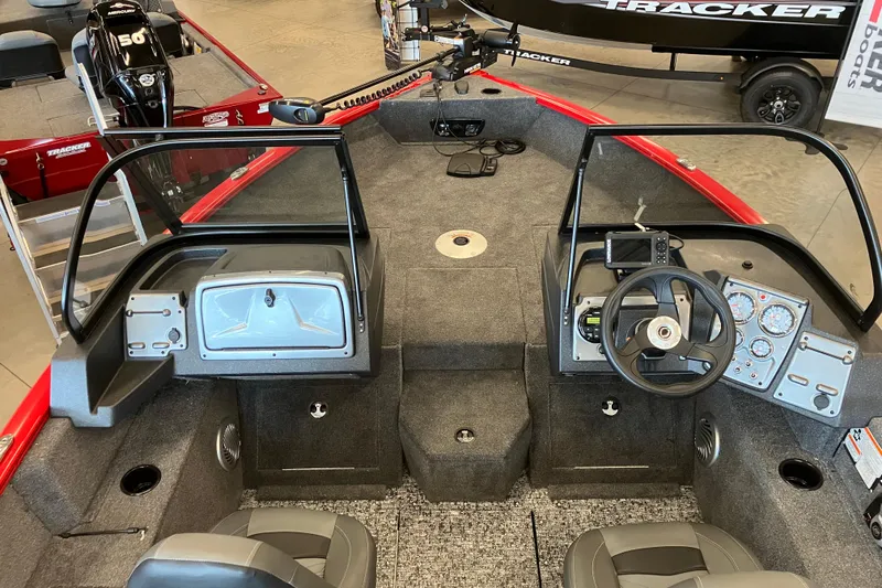 Slide: The Image of 2026 Tracker Pro Guide V-175 WT boat interior with steering wheel and dashboard controls. - 3