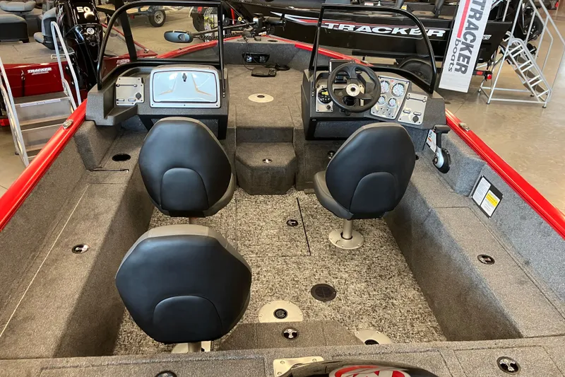 Slide: The Image of 2026 Tracker Pro Guide V-175 WT boat interior with dual seats and control panel. - 2