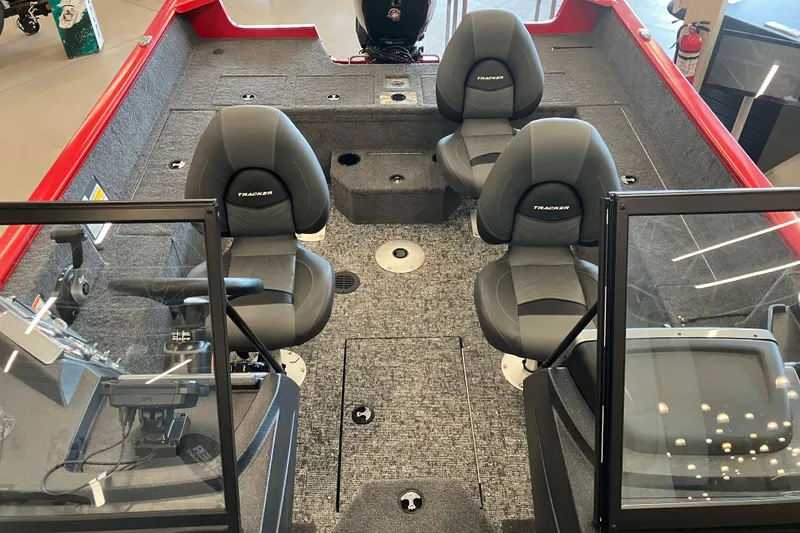 Slide: The Image of 2026 Tracker Pro Guide V-175 WT boat interior with three seats and steering console. - 4