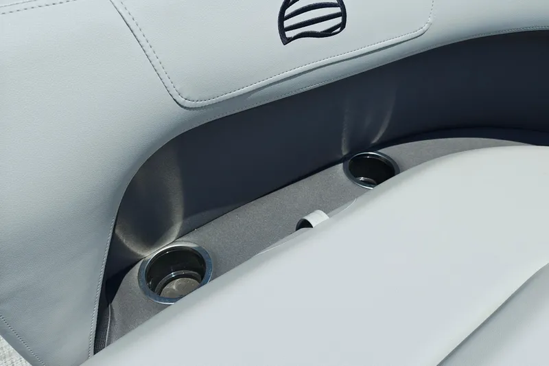 Slide: The Image of 2026 Sun Tracker Party Barge 18 DLX interior with cup holders and sleek seating. - 10