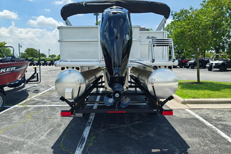 Slide: The Image of 2026 Sun Tracker Party Barge 18 DLX pontoon boat on trailer, rear view. - 20