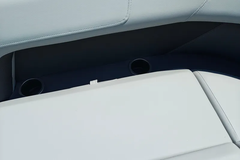 Slide: The Image of 2026 Sun Tracker Party Barge 18 DLX interior seating with cup holders. - 19