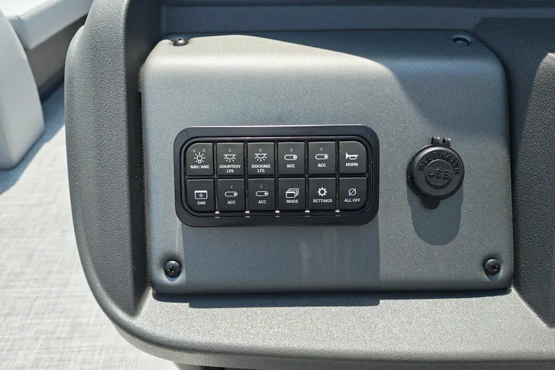 Slide: The Image of Control panel of 2026 Sun Tracker Party Barge 18 DLX with USB port and various switches. - 14