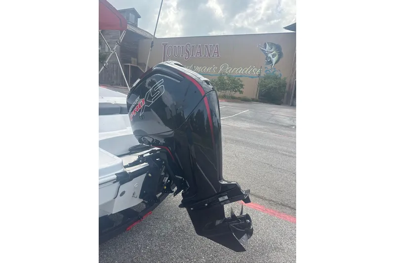 Slide: The Image of 2026 Tahoe T18 boat with Mercury Pro XS outboard motor in parking lot. - 4