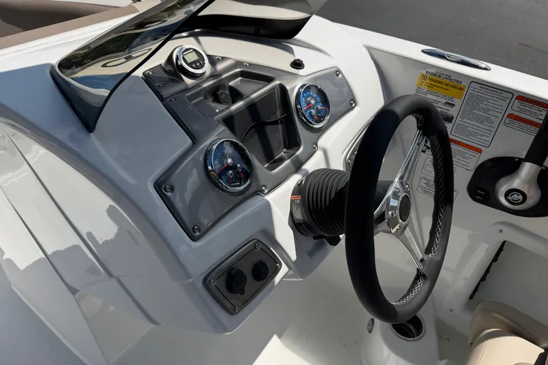 Slide: The Image of Steering console of 2026 Tahoe 1950 boat with gauges and controls. - 10