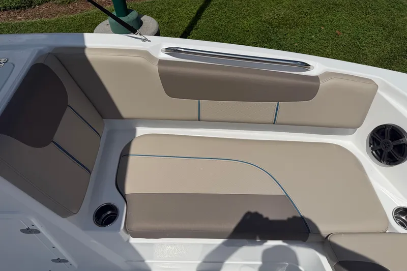 Slide: The Image of 2026 Tahoe 1950 boat interior with beige seating and speaker detail. - 13