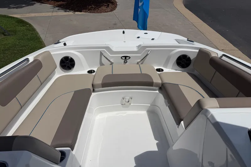 Slide: The Image of 2026 Tahoe 1950 boat interior with beige seating and speakers. - 23