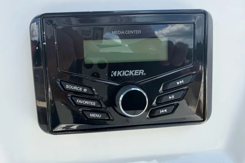 Slide: The Image of Kicker media center in 2026 Tahoe 1950 model, featuring control buttons and display. - 7